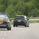 Stock photo of police car going after another car