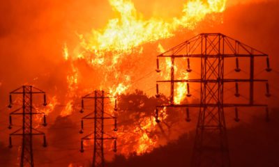 Photo of flames burning near power lines in Sycamore Canyon
