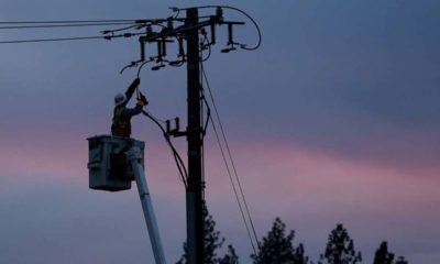 Photo of PG&E line worker at sunset