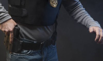 Photo of police officer holding a gun