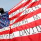 Photo of Malaki Seku holding an American flag
