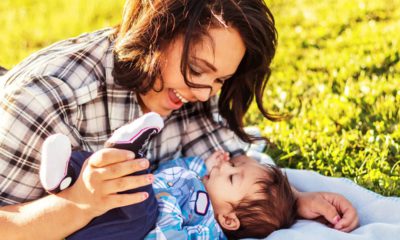 Photo of a teenaged mother spending time with her baby