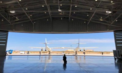 Virgin Galactic ground crew guiding the company carrier plane