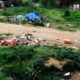 Photo of trash and a homeless tent in Sacramento