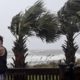 Photo of a man taking photos of waves crashing in Myrtle Beach