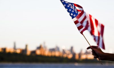 Photo of a person holding an American flag