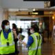 Photo of airport workers waring masks in Washington