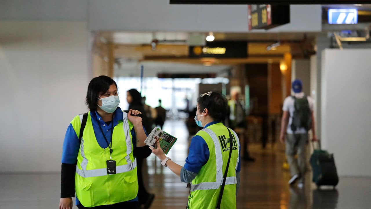 Photo of airport workers waring masks in Washington